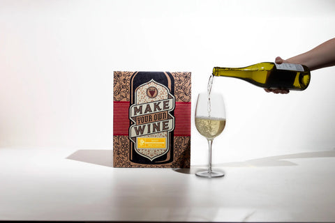 Pouring a glass of homemade moscato from Craft a Brew