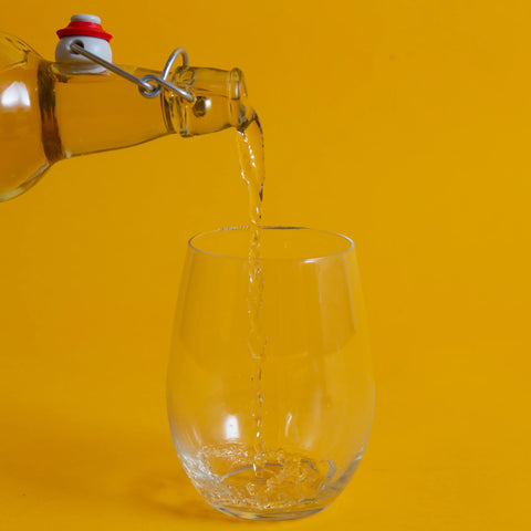 Pouring a glass of honey wine